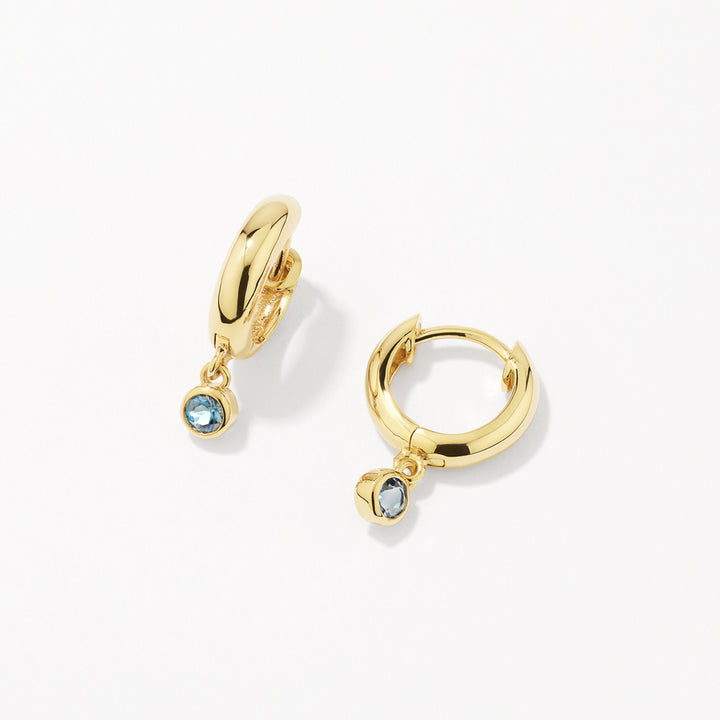 Blue Topaz Round Drop Charm Huggie Earrings in Gold