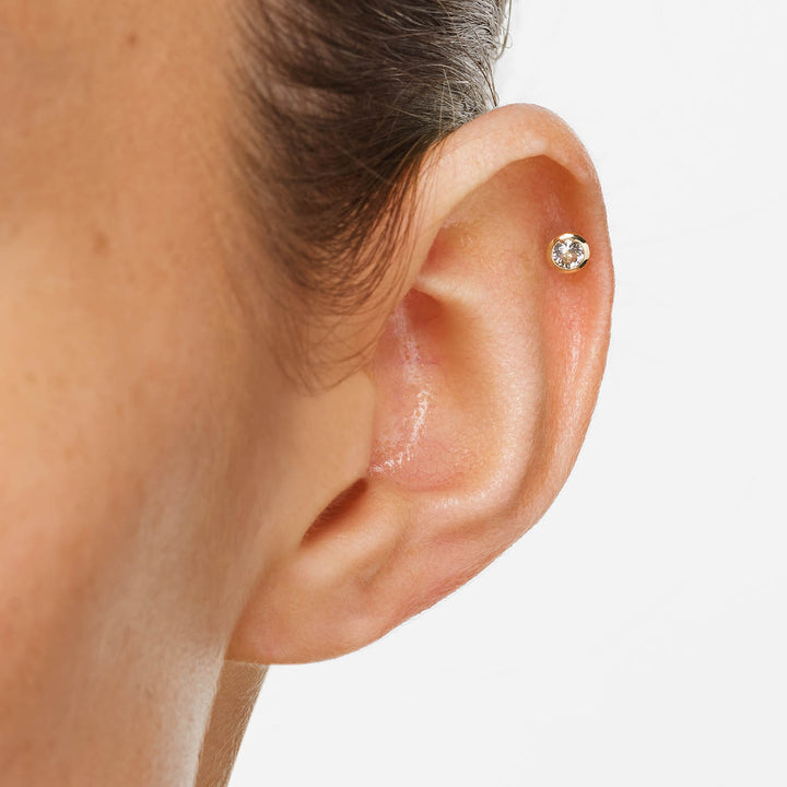 White Topaz Bezel Helix Single Stud in 10k Gold