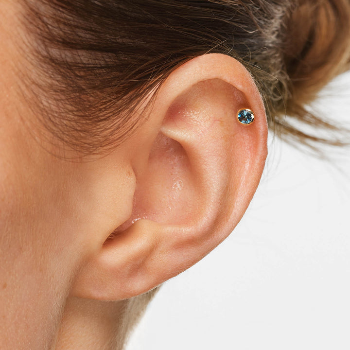 Blue Topaz Bezel Helix Single Stud in 10k Gold