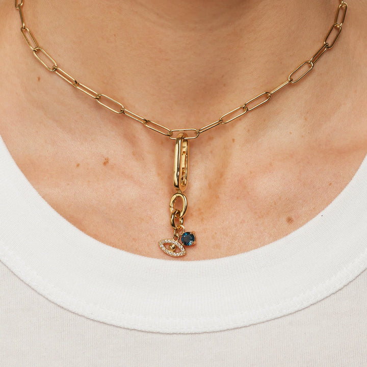 Blue Topaz Round Charm Pendant in Gold
