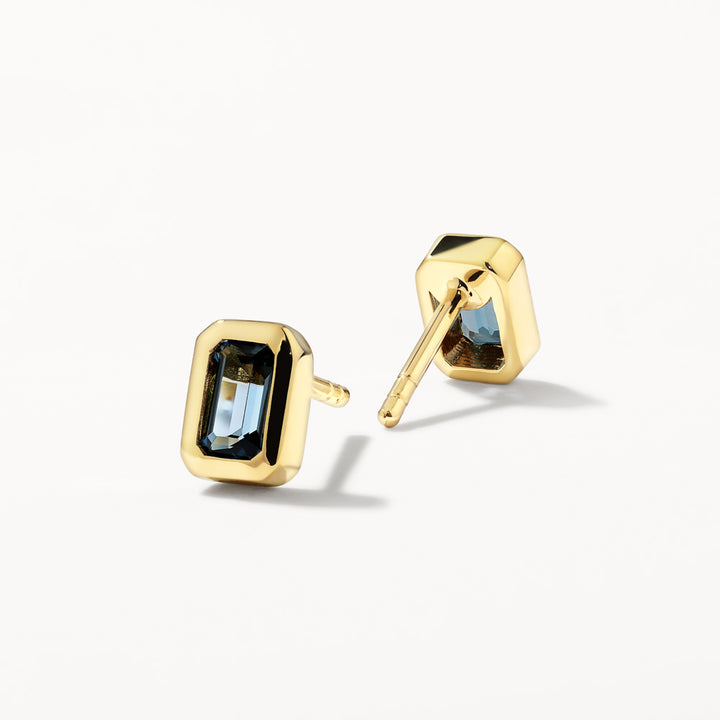 Blue Topaz Emerald Cut Stud Earrings in Gold