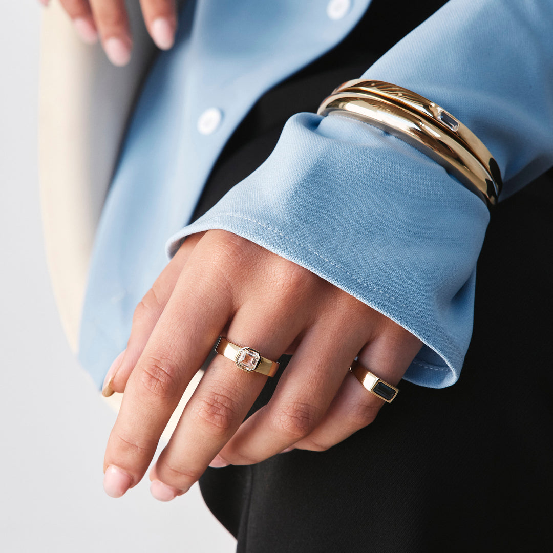 Medley Ring Blue Topaz Open Bezel Cigar Band in Gold