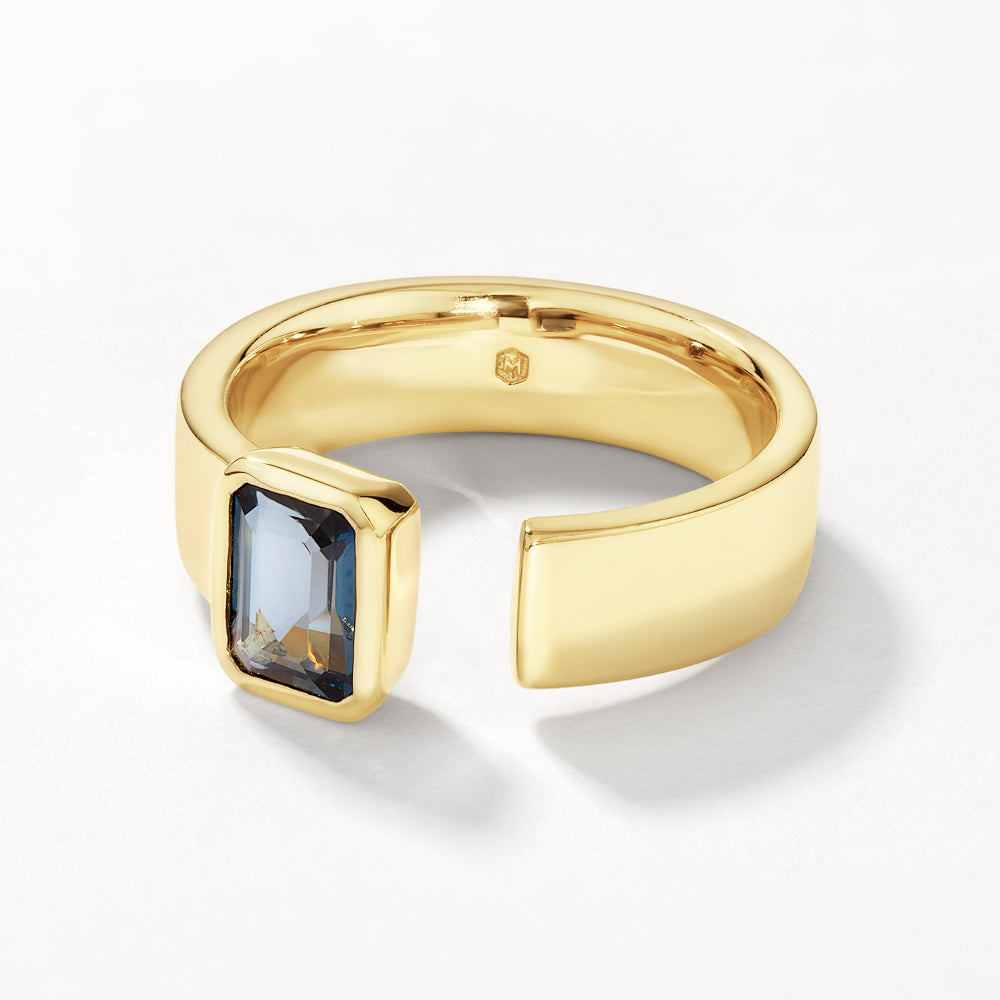 Medley Ring Blue Topaz Open Bezel Cigar Band in Gold