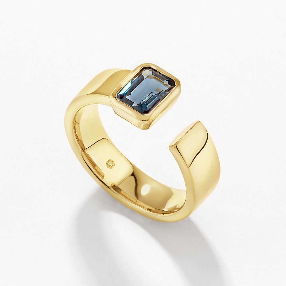 Medley Ring Blue Topaz Open Bezel Cigar Band in Gold