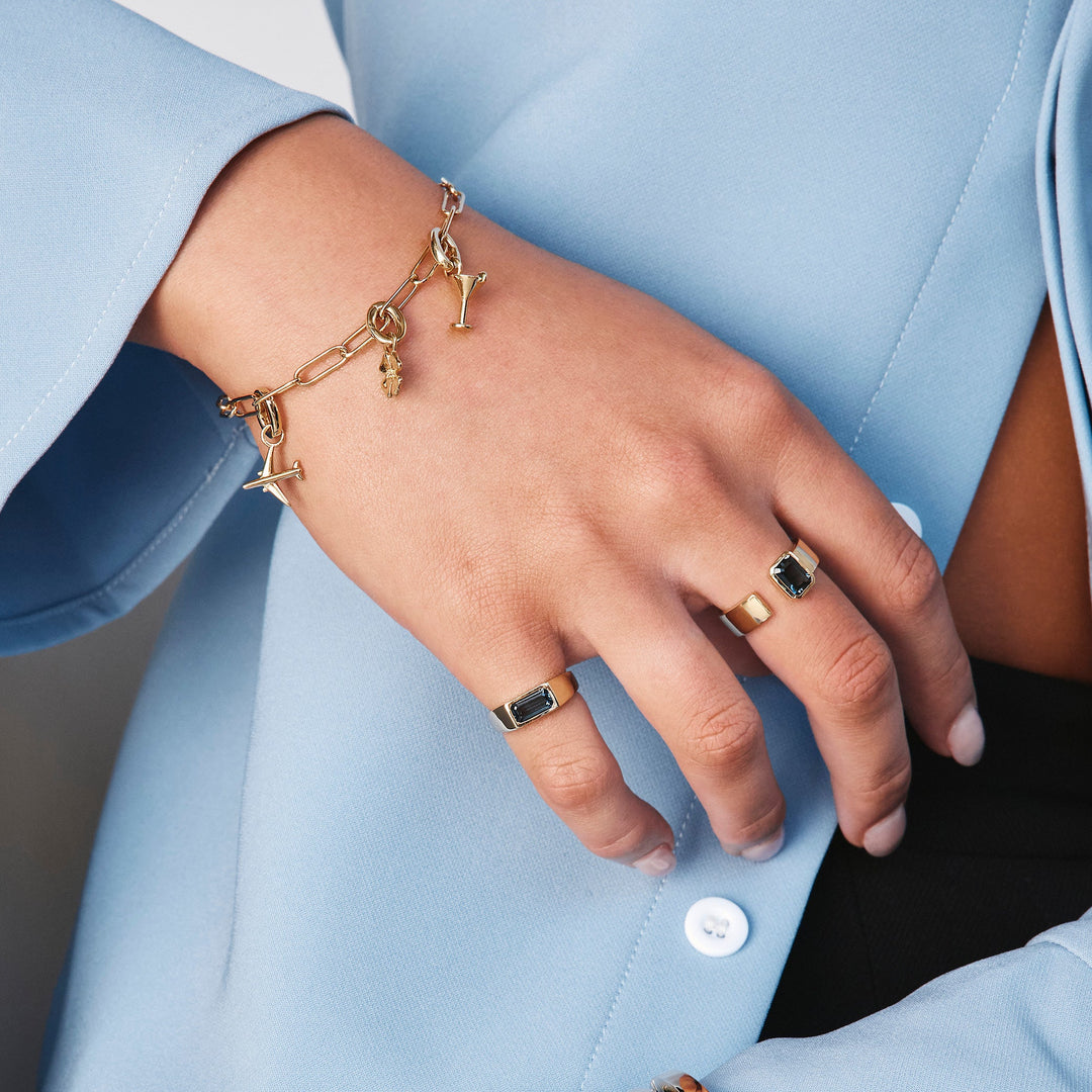 Medley Ring Blue Topaz Open Bezel Cigar Band in Gold