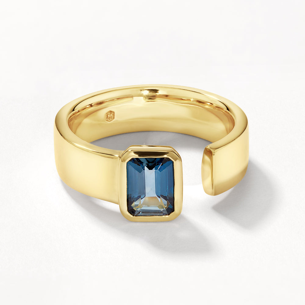Medley Ring Blue Topaz Open Bezel Cigar Band in Gold