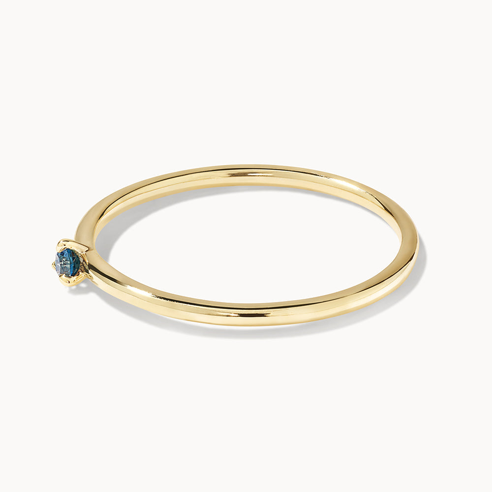 Medley Ring Micro Blue Topaz Round Solitaire Ring in 10k Gold