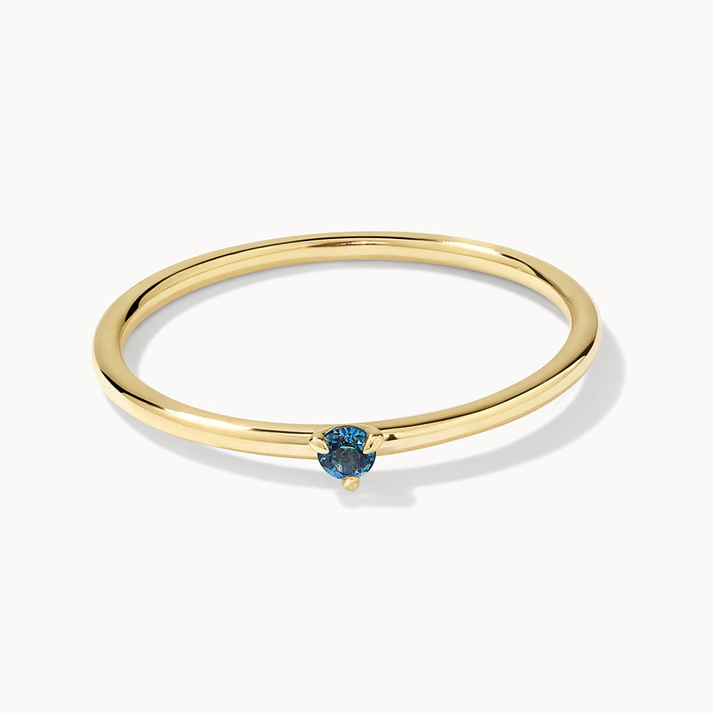 Medley Ring Micro Blue Topaz Round Solitaire Ring in 10k Gold