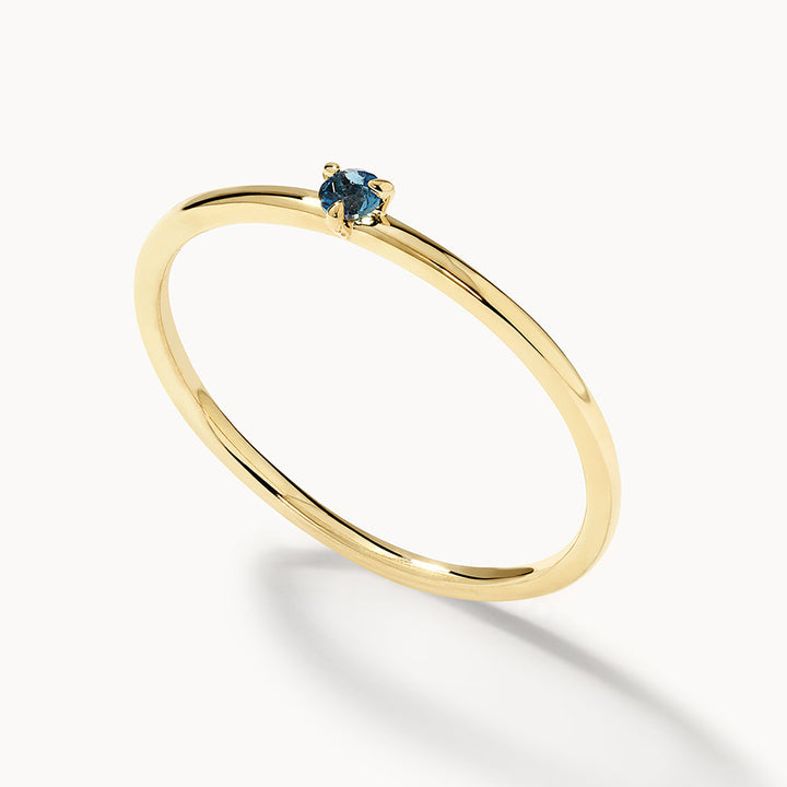 Medley Ring Micro Blue Topaz Round Solitaire Ring in 10k Gold